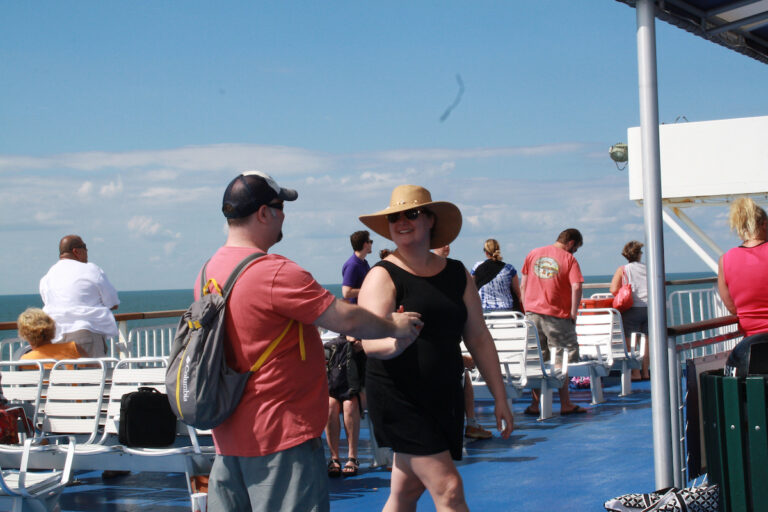A couple dances hand-in-hand during the Sunday Jamz event on the Ferry