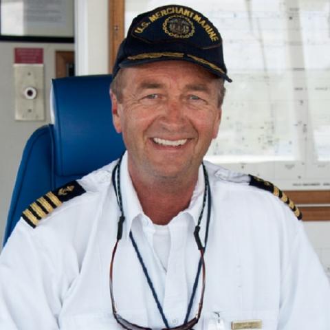 Head shot of Captain Robert Vance in uniform along with a black Cape May - Lewes Ferry cap