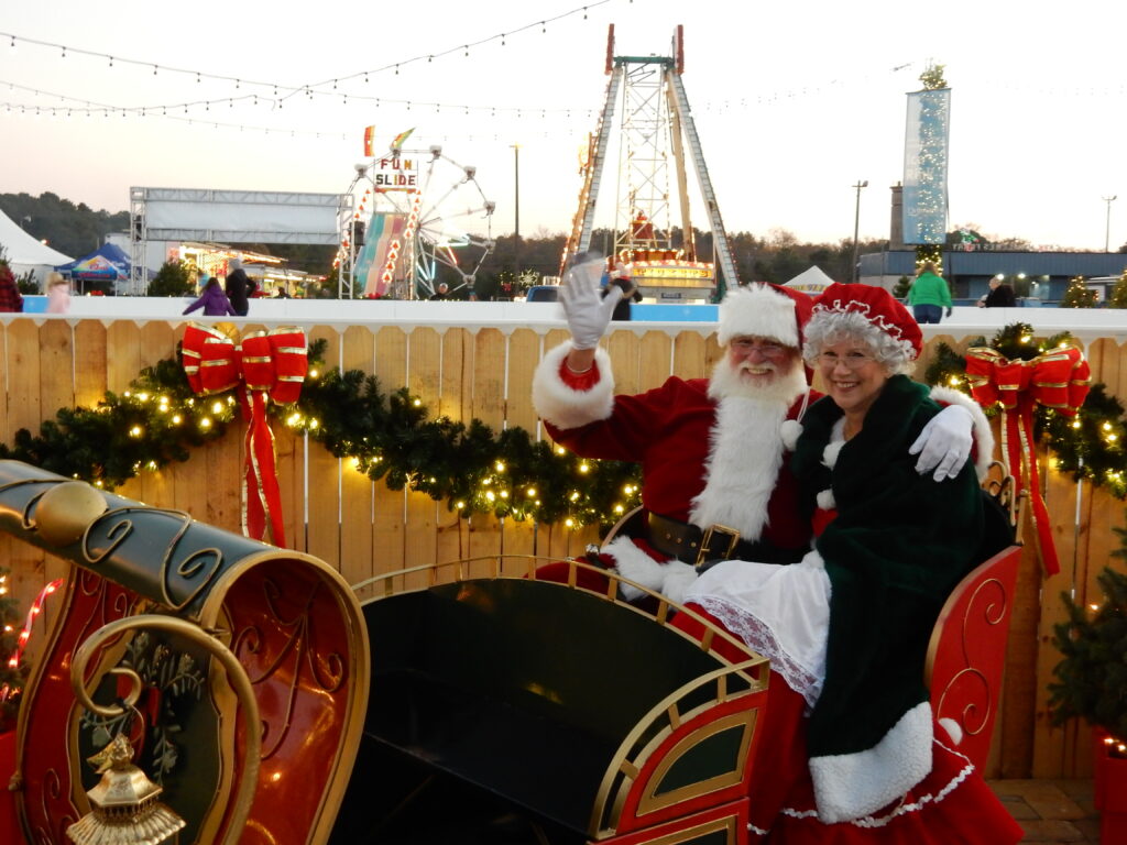 Mr and Mrs Clause pose from a sleigh ride
